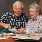 Senior couple working on a scrapbook together