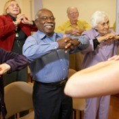 Seniors participating in a stretching class