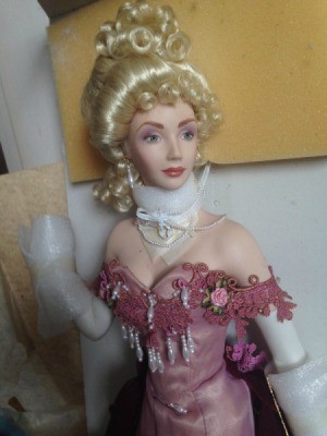 doll with elegant hairstyle and evening dress