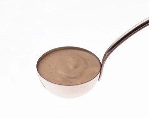 Ladle holding Italian Salad Dressing