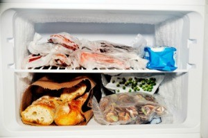 Contents of a freezer compartment from a refrigerator with the freezer on top