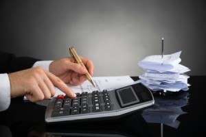 Using calculator to balance checkbook with a large stack of receipts