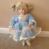 blond haired doll in blue dress