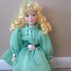 blonde haired doll with aqua dress