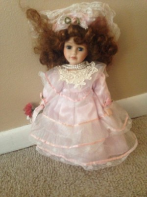 doll wearing a pink dress