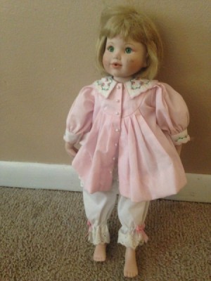 doll in pink dress and bloomers