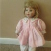 doll in pink dress and bloomers