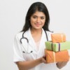 Nurse with stethoscope holding three orange and green wrapped presents