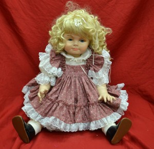 blonde doll in pink flowered and white dress
