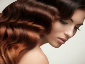 Woman with shiny soft hair set in waves