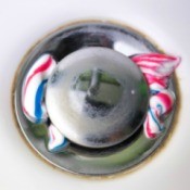 Sink drain with blobs of toothpaste surrounding it