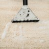 Close up of carpet shampooer removing suds from carpet