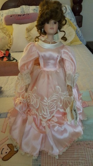 doll with undo hair style and long formal pink gown