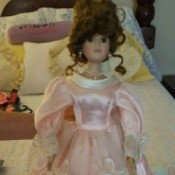 doll with undo hair style and long formal pink gown