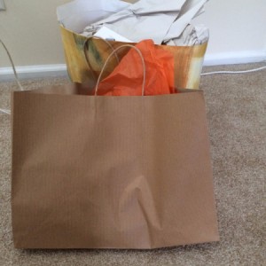 Two shopping bags with items inside.