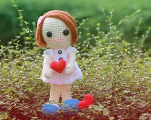 Crocheted Doll holding a heart