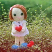 Crocheted Doll holding a heart
