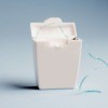 Dental Floss Container isolated on shadowed white background.