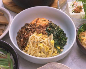 Korean food spread centered on meal in a bowl