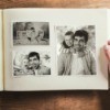 Looking at a photo album showing pictures of a man and his family