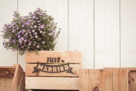 Wood crate with "Just Married" written on it.