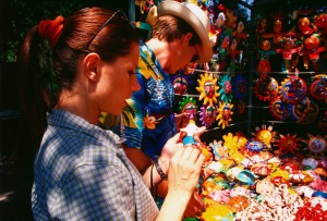 Couple looking at crafts at an outdoor market