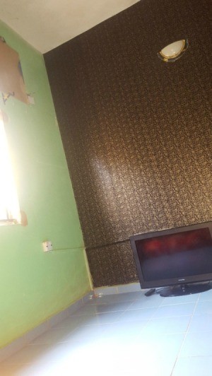bedroom painted and papered walls