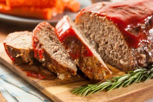 Meatloaf with several slices ready to be served