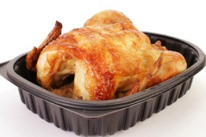 Rotisserie chicken in a plastic to go box