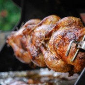 Rotisserie style chicken being made on a home BBQ