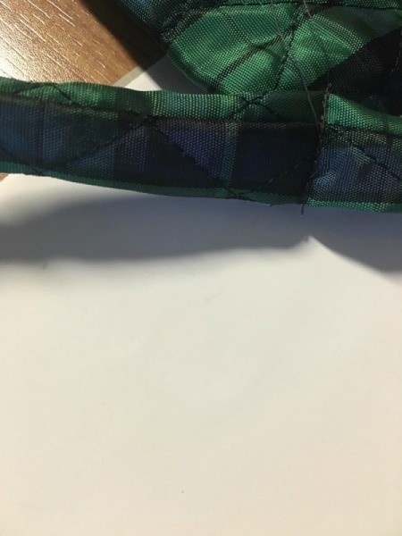 Attaching the ties to the seat of the chair.