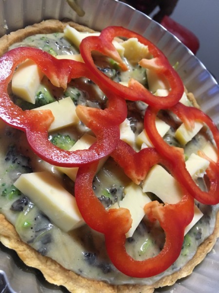 Savoury Cheese and Vegetable Tart - putting red peppers on top