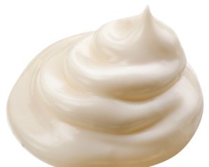 Pile of mayonnaise on white background