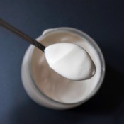 Top view of a jar of mayonnaise with spoon