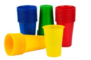 Four stacks of plastic cups red, yellow, green, and blue