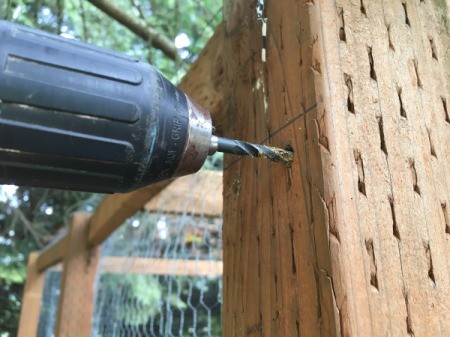 Drilling a hole for the kayak hanging hardware.
