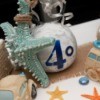Display of items surrounding a silver ball ornament with 40 written on it