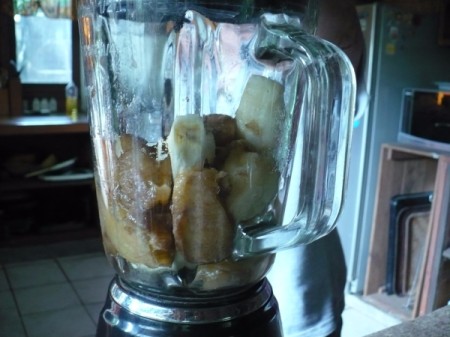 Bananas and other ingredients in a blender.