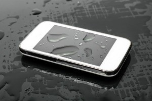 Smart Phone with large drops of water on and around it