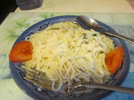 Linguine with Fresh Clam Sauce - linguine on plate with parm on top.