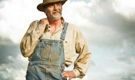 Farmer wearing dirty overalls