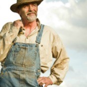 Farmer wearing dirty overalls