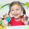 Little girl with finger puppets in puppet theater