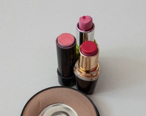 Three old used tubes of lipstick