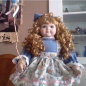 doll holding a balloon