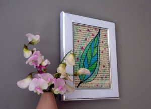 framed book page with watercolor artwork