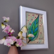 framed book page with watercolor artwork