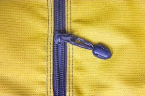 Purple plastic zipper in yellow fabric