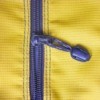 Purple plastic zipper in yellow fabric