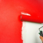 Paint Roller being used to paint walls red